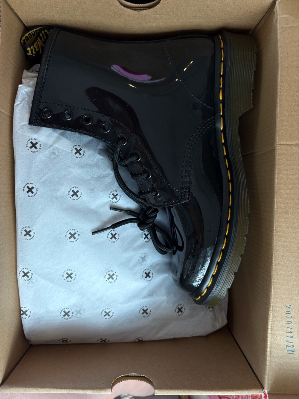 Dr. Martens Black and Yellow Rubber-Soled Shoe (partial view)